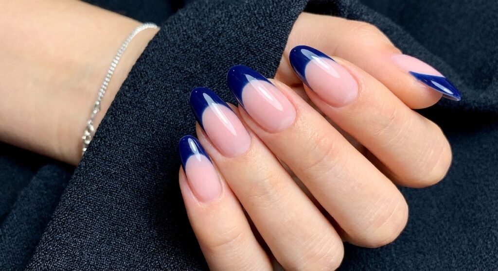 Navy blue French tips offer a sophisticated alternative to black while maintaining that edgy appeal. This rich shade works beautifully in professional settings and transitions seamlessly to evening events. 