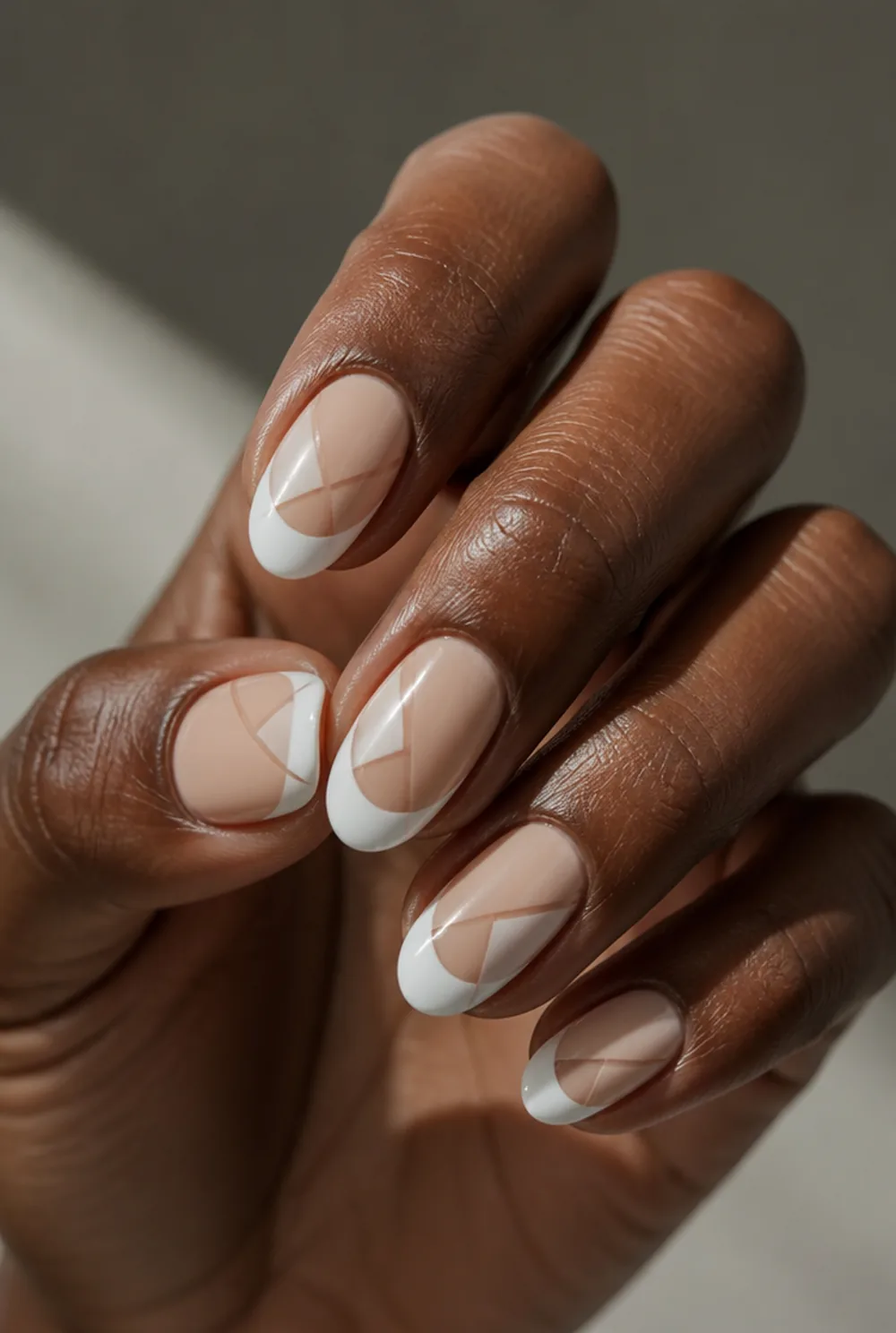 geometric negative space nail art on deep brown skin - PolishedAndPrettyNails.com geometric negative space nail art on deep brown skin