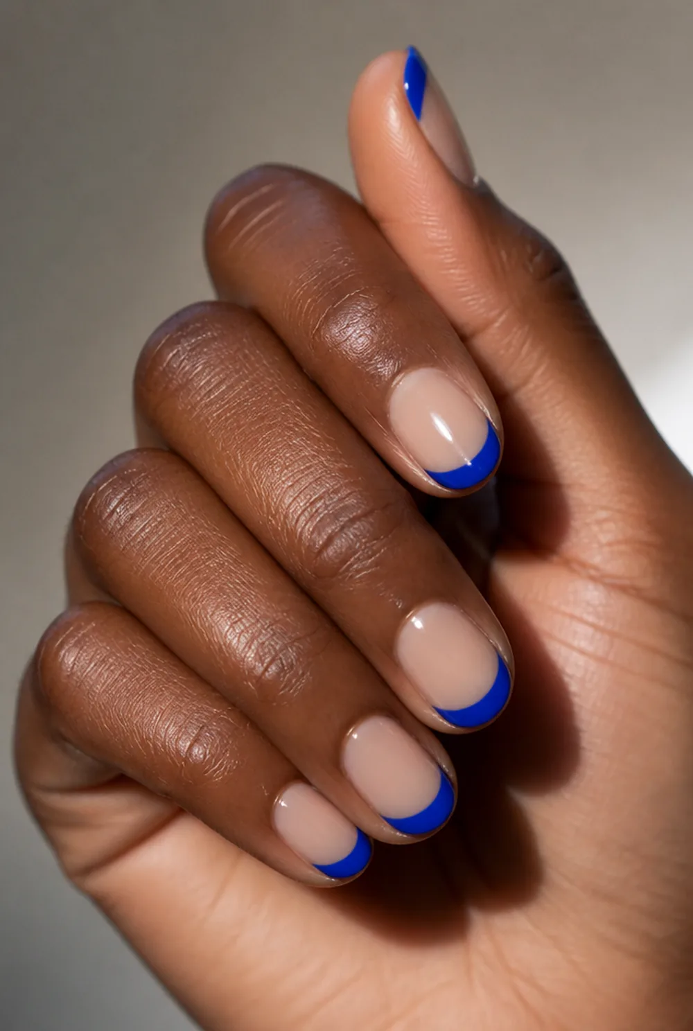 electric blue energy french tip nails nail art on deep brown skin