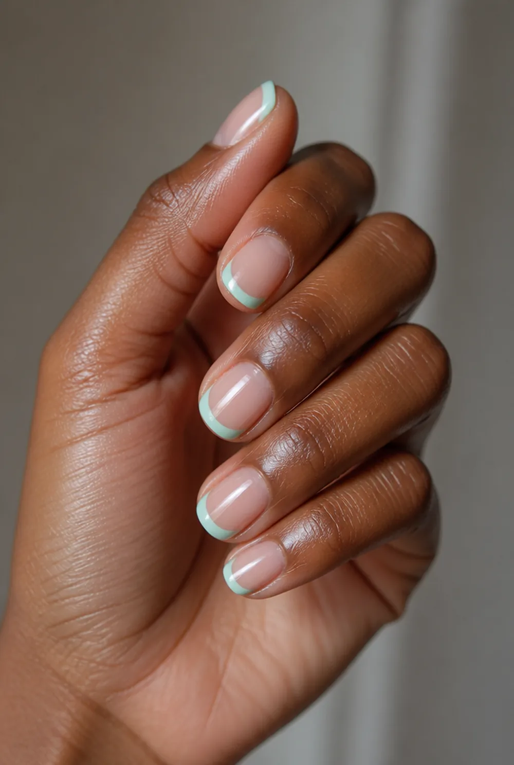 mint green freshness french tip nails nail art on deep brown skin