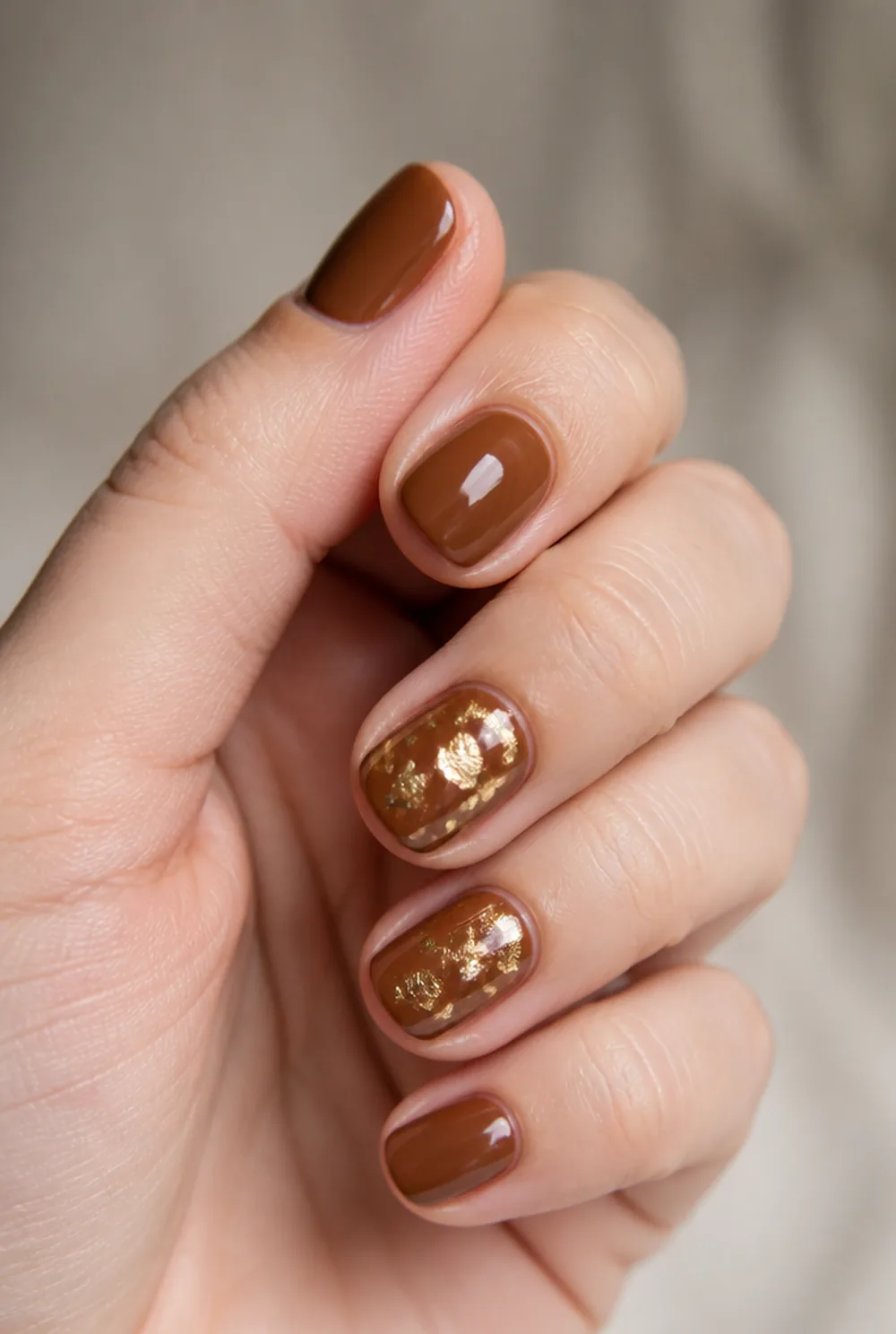 toffee with gold fleck nail art on fair skin short length - PolishedAndPrettyNails.com toffee with gold fleck nail art on fair skin, short length