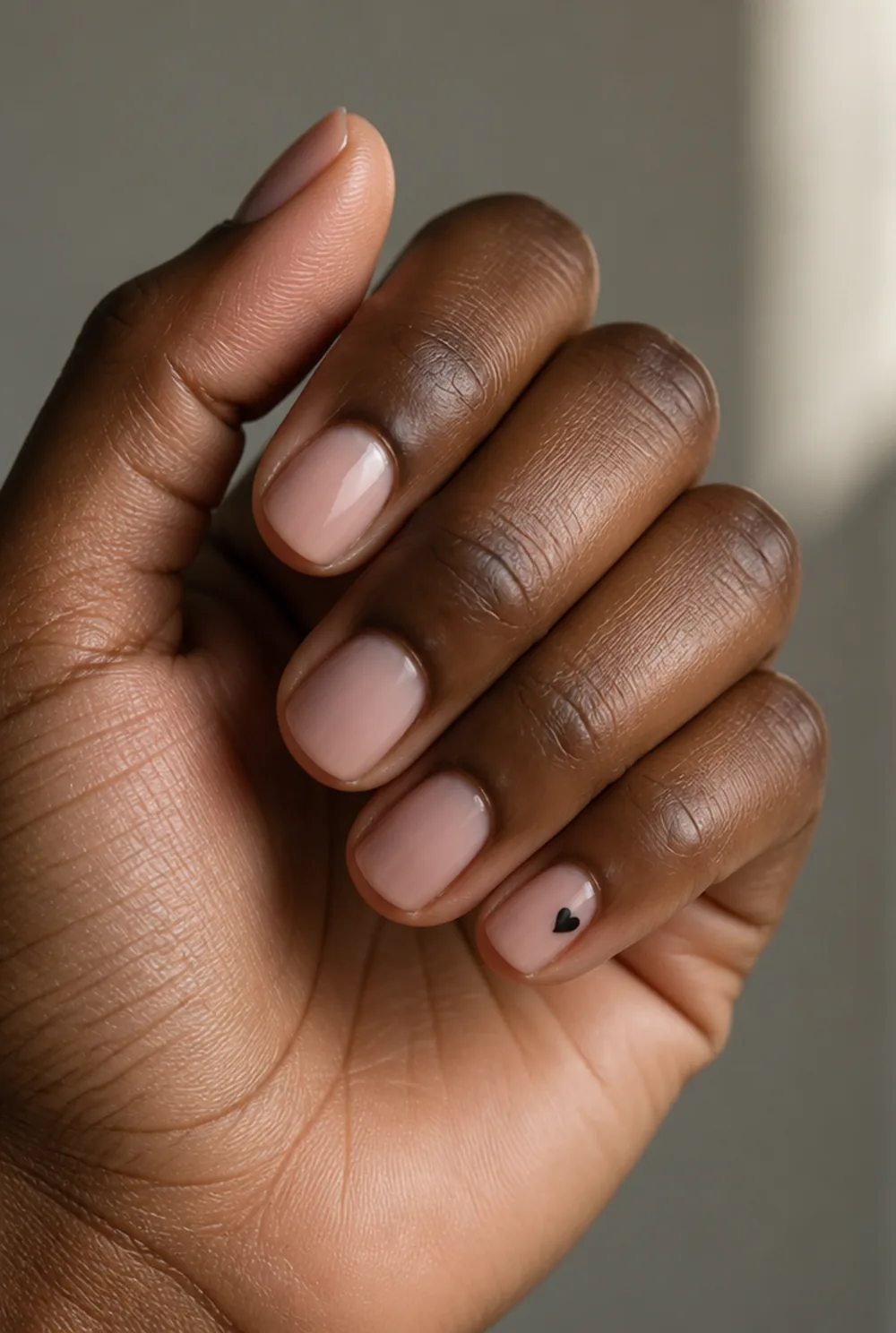 tiny heart pinky nail art on deep brown skin - PolishedAndPrettyNails.com tiny heart pinky nail art on deep brown skin
