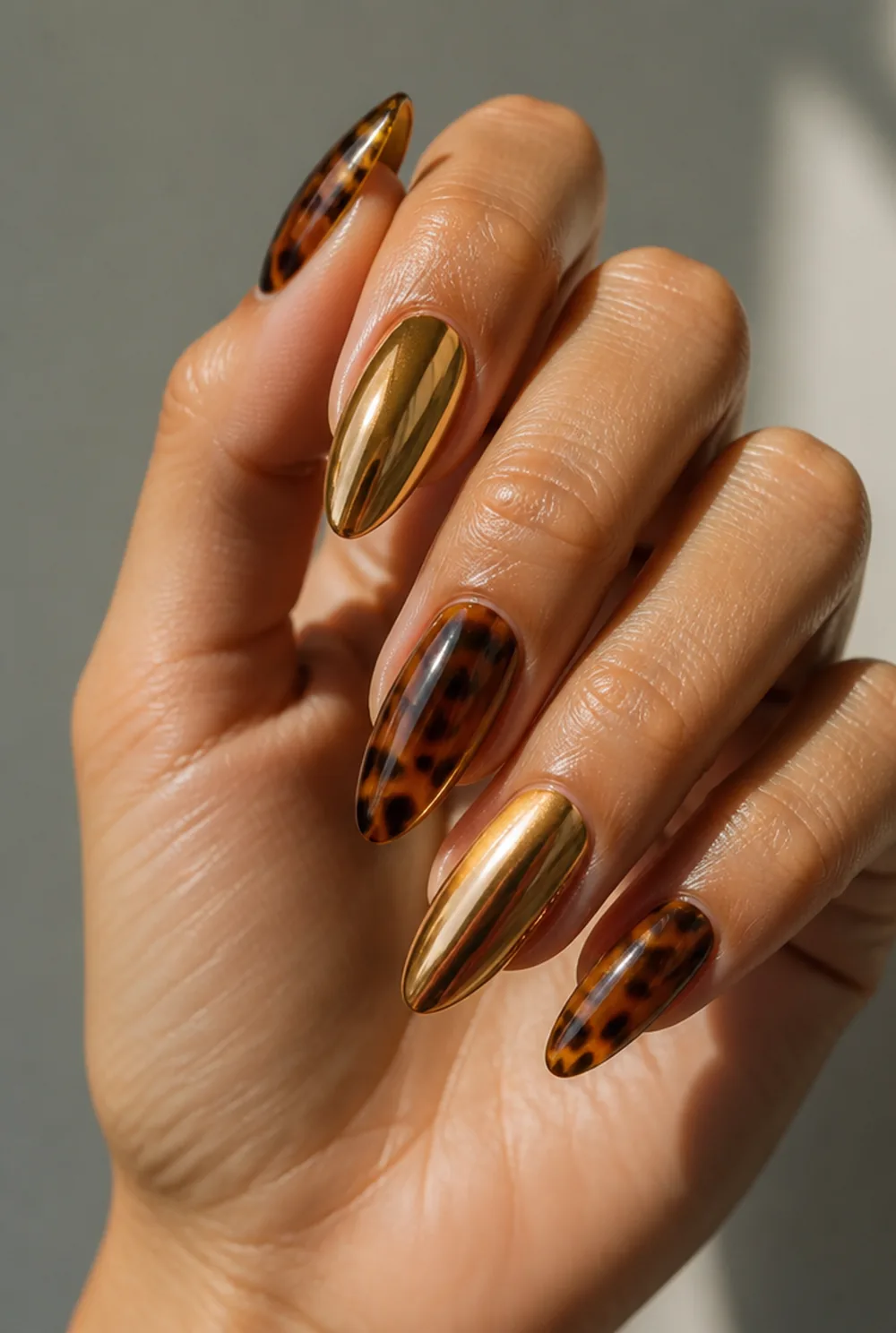 tortoise and gold chrome mix nail art on olive skin long length - PolishedAndPrettyNails.com tortoise and gold chrome mix nail art on olive skin, long length