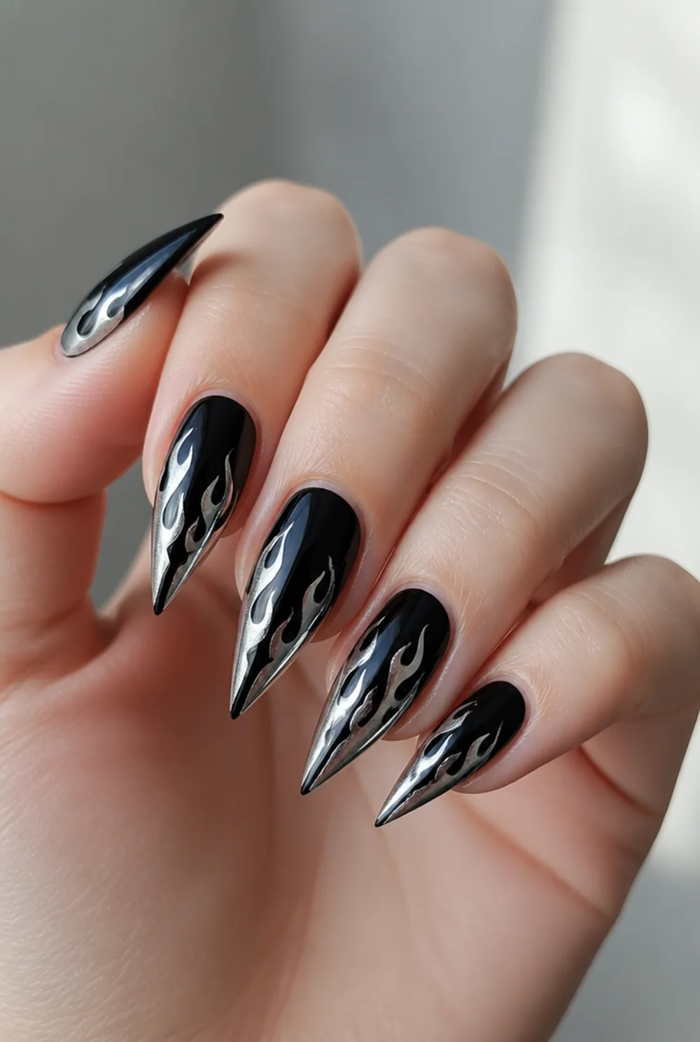 y2k flame stiletto nail art on fair skin short length - PolishedAndPrettyNails.com y2k flame stiletto nail art on fair skin, short length