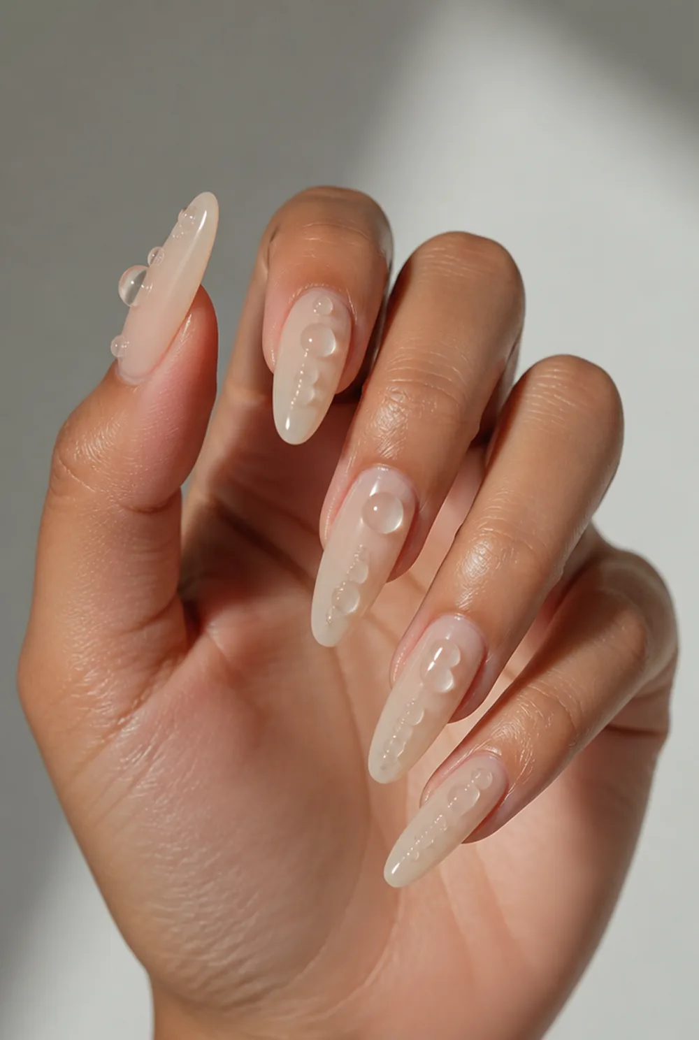 3d gel droplets on nude nail art on olive skin long length - PolishedAndPrettyNails.com 3d gel droplets on nude nail art on olive skin, long length