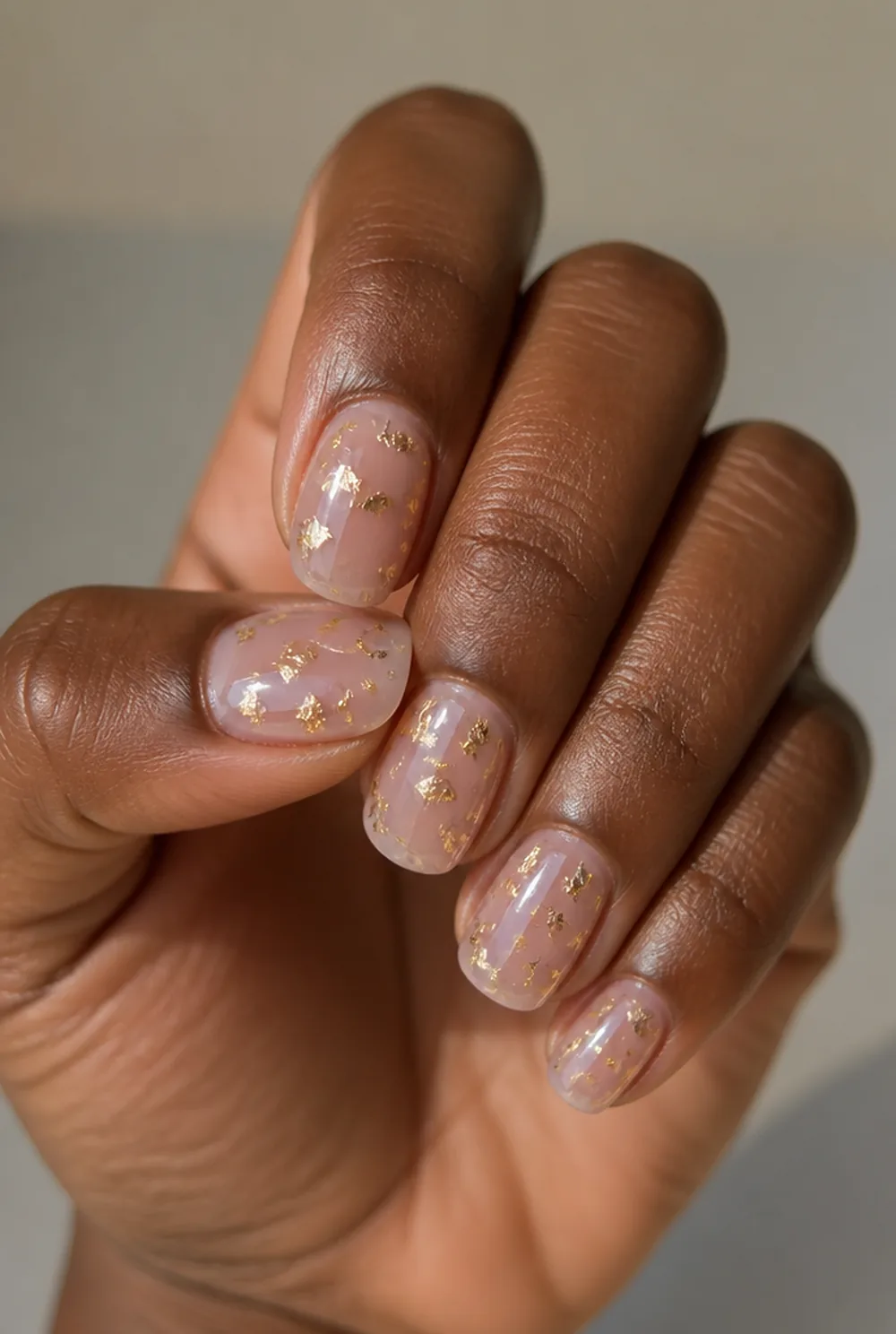 lipgloss nails with gold flakes nail art on deep brown skin - PolishedAndPrettyNails.com lipgloss nails with gold flakes nail art on deep brown skin