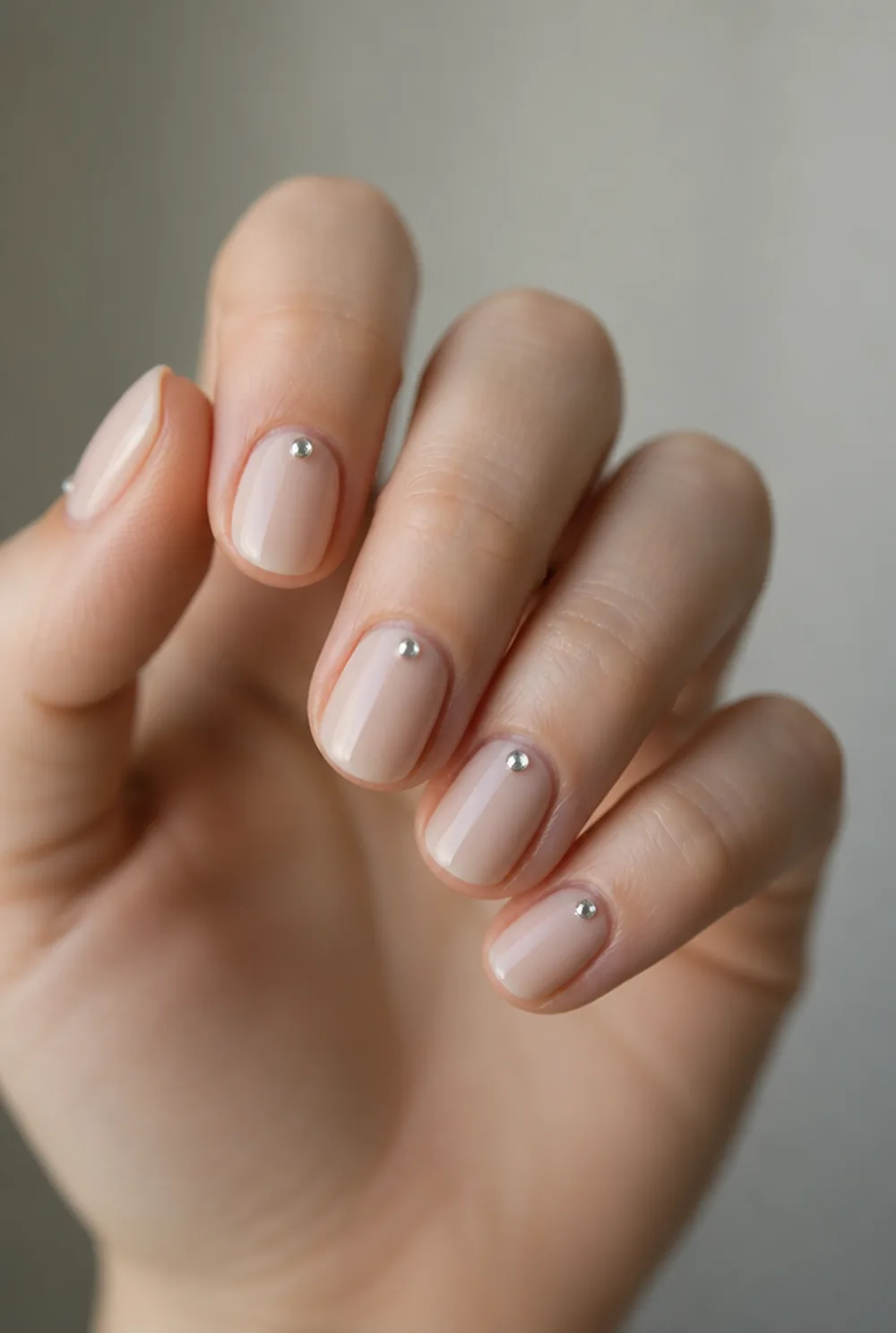 rhinestone studs on milky nude nail art on fair skin short length - PolishedAndPrettyNails.com rhinestone studs on milky nude nail art on fair skin, short length
