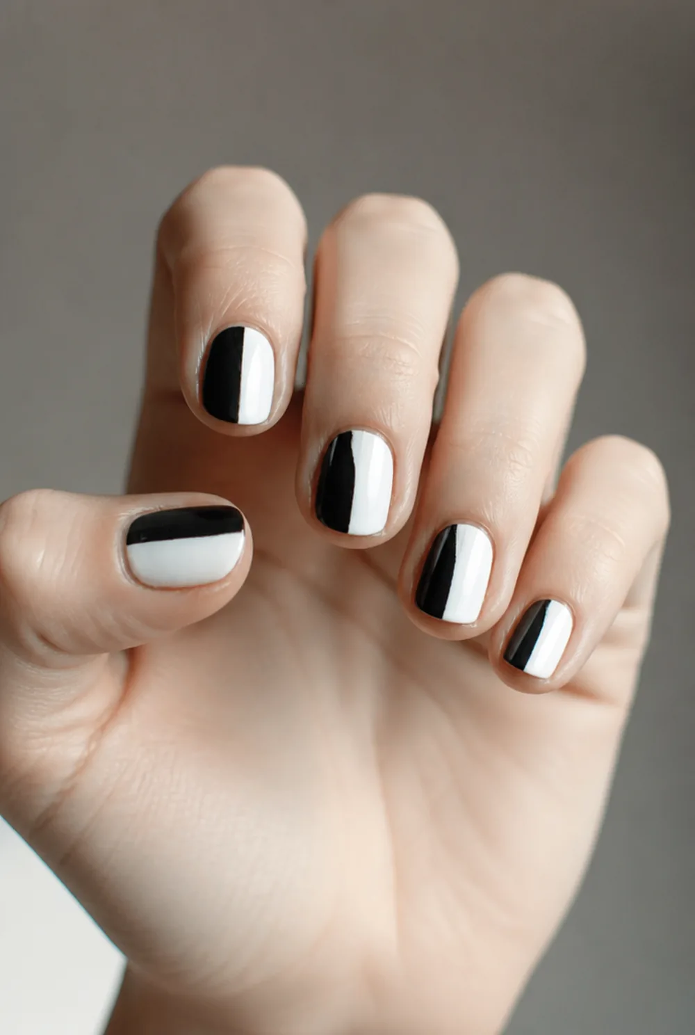 half-half split nail art on fair skin, short length