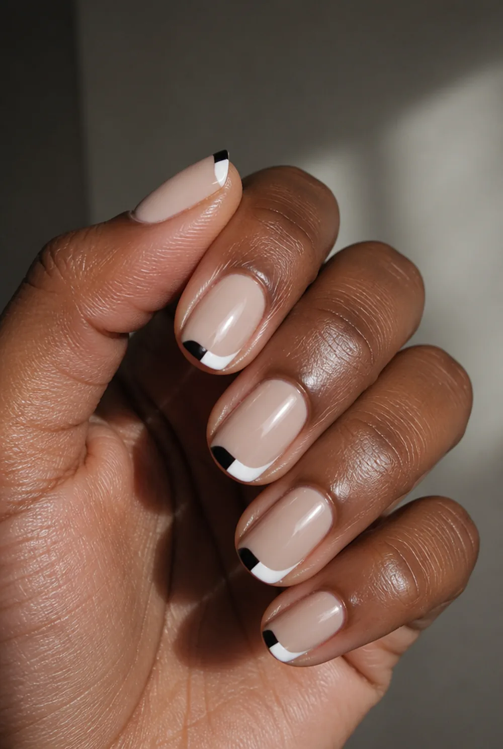 split french tips nail art on deep brown skin