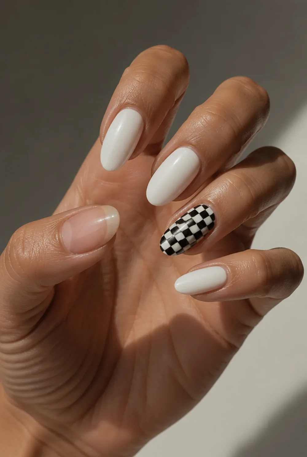 checkerboard accent nail art on olive skin, long length