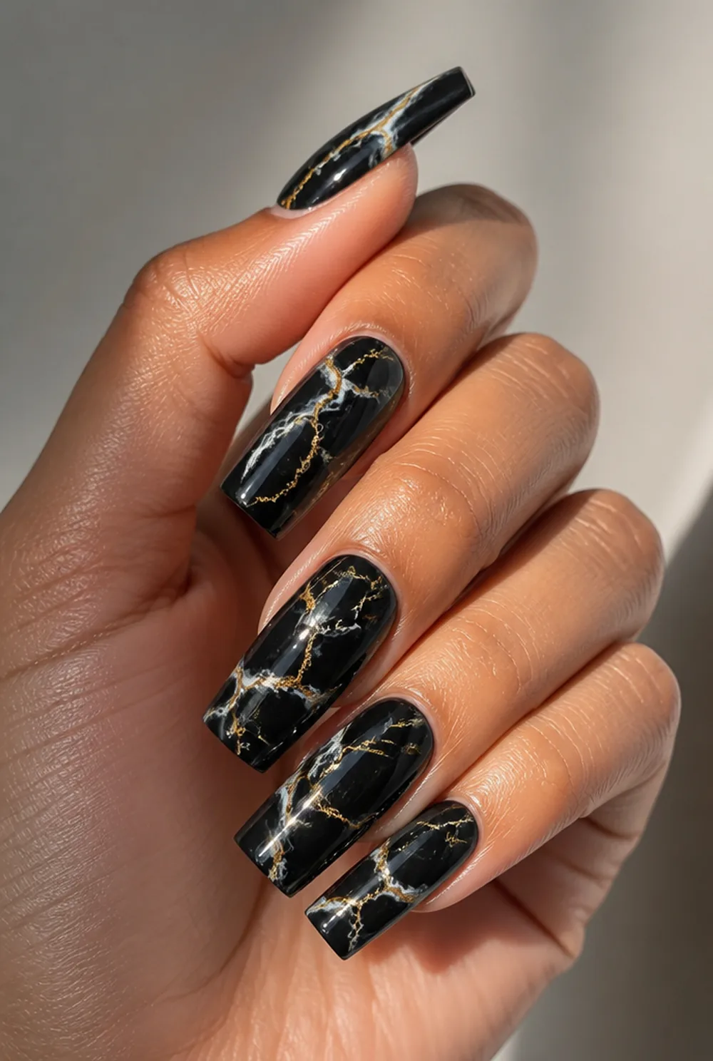 black marble nail art on olive skin, long length