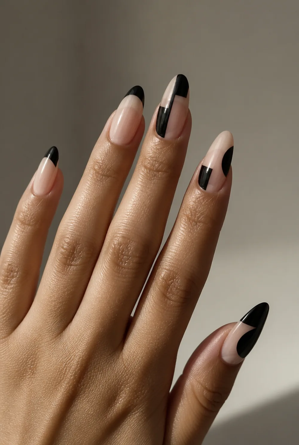 black negative space nail art on olive skin, long length