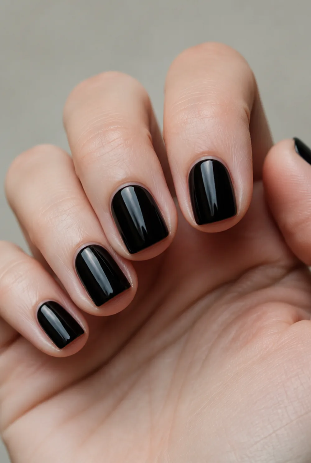 onyx short square nail art on fair skin, short length