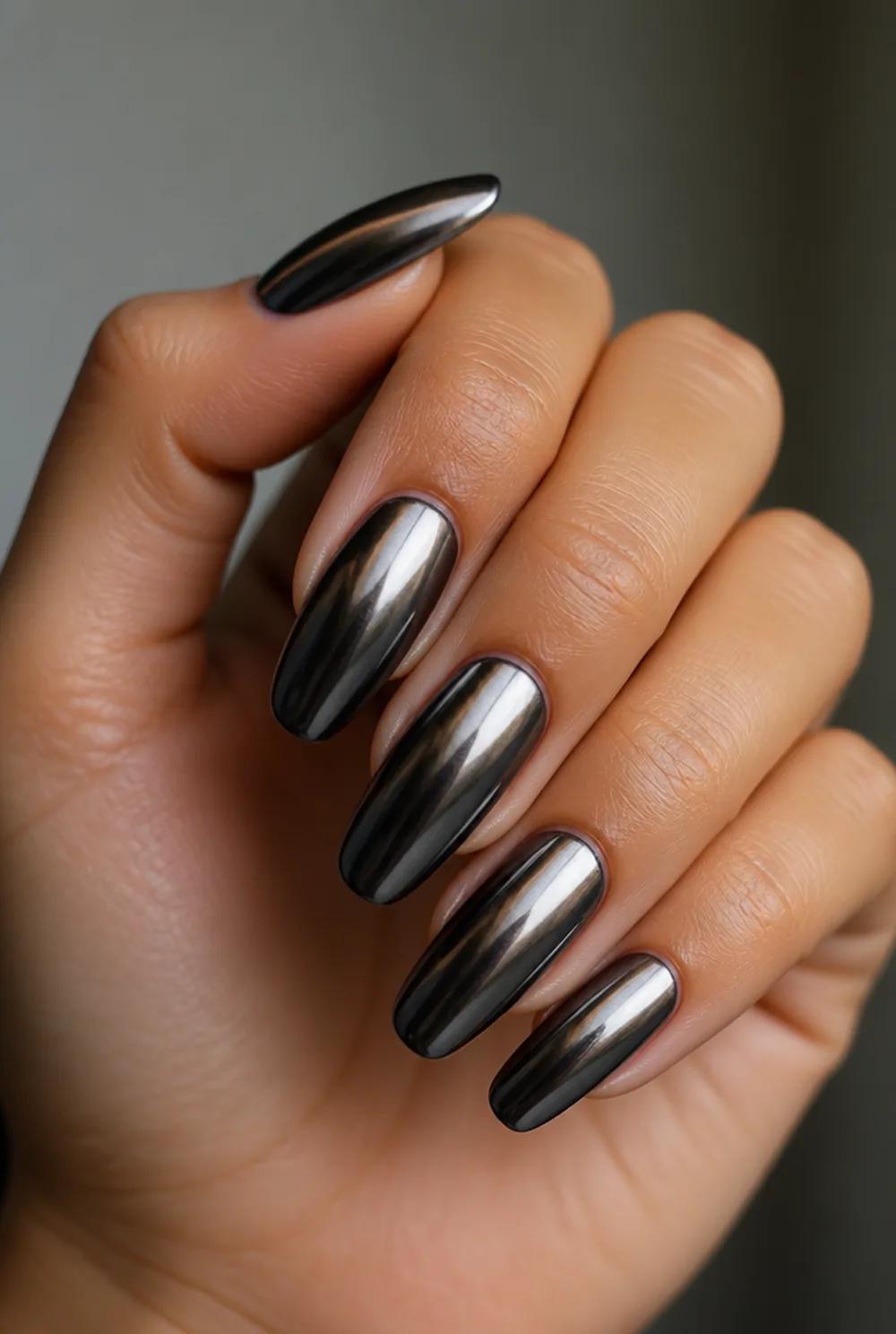 black chrome nail art on olive skin, long length
