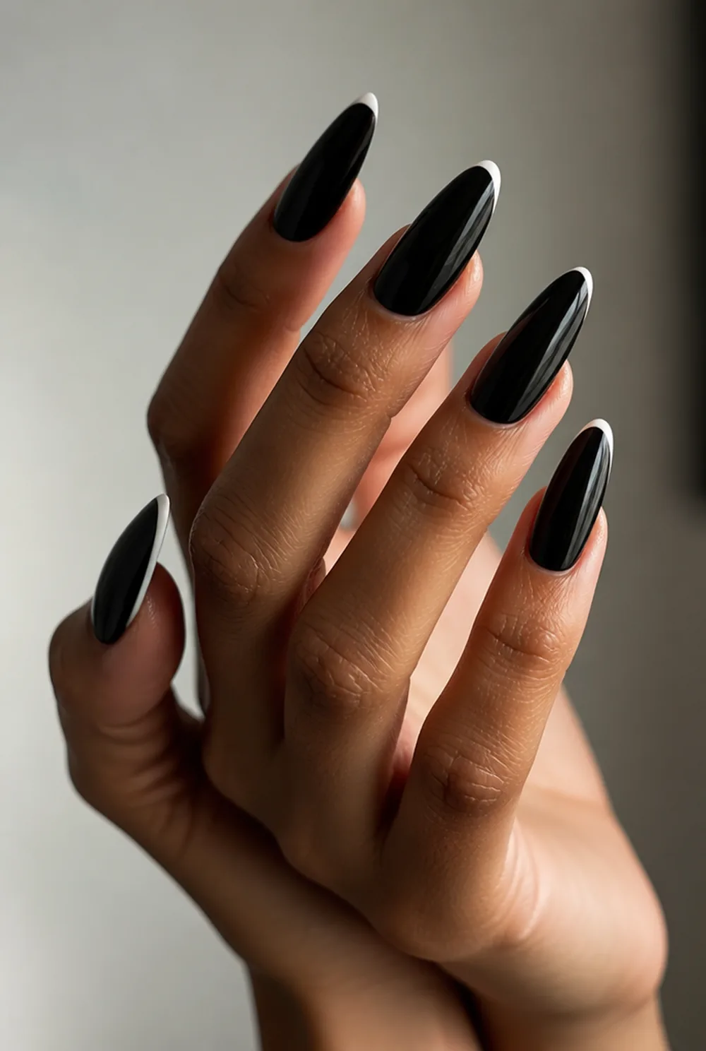 black with white tips nail art on olive skin, long length