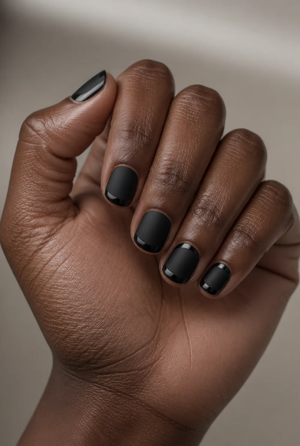 blackout french nail art on deep brown skin