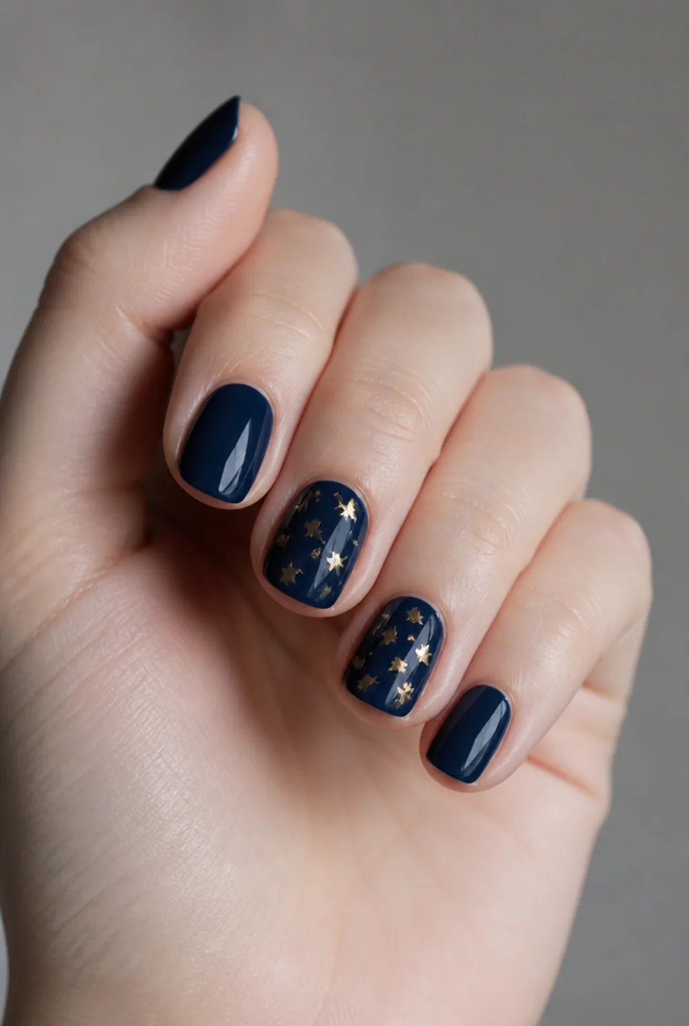 midnight blue with gold stars nail art on fair skin short length - PolishedAndPrettyNails.com midnight blue with gold stars nail art on fair skin, short length