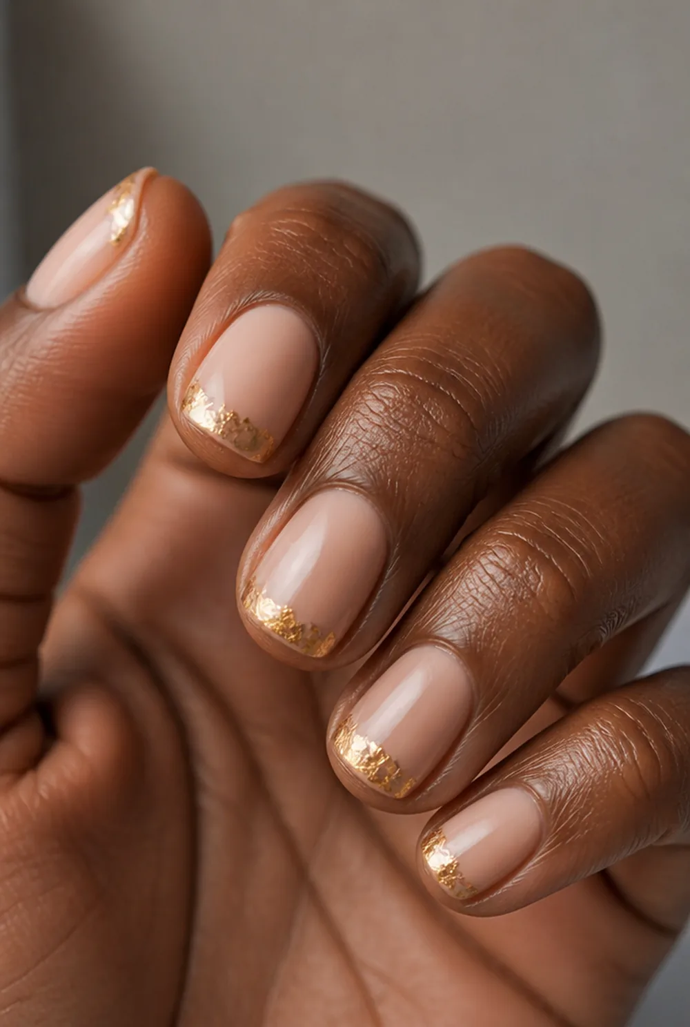 gold-foil french nail art on deep brown skin - PolishedAndPrettyNails.com gold-foil french nail art on deep brown skin