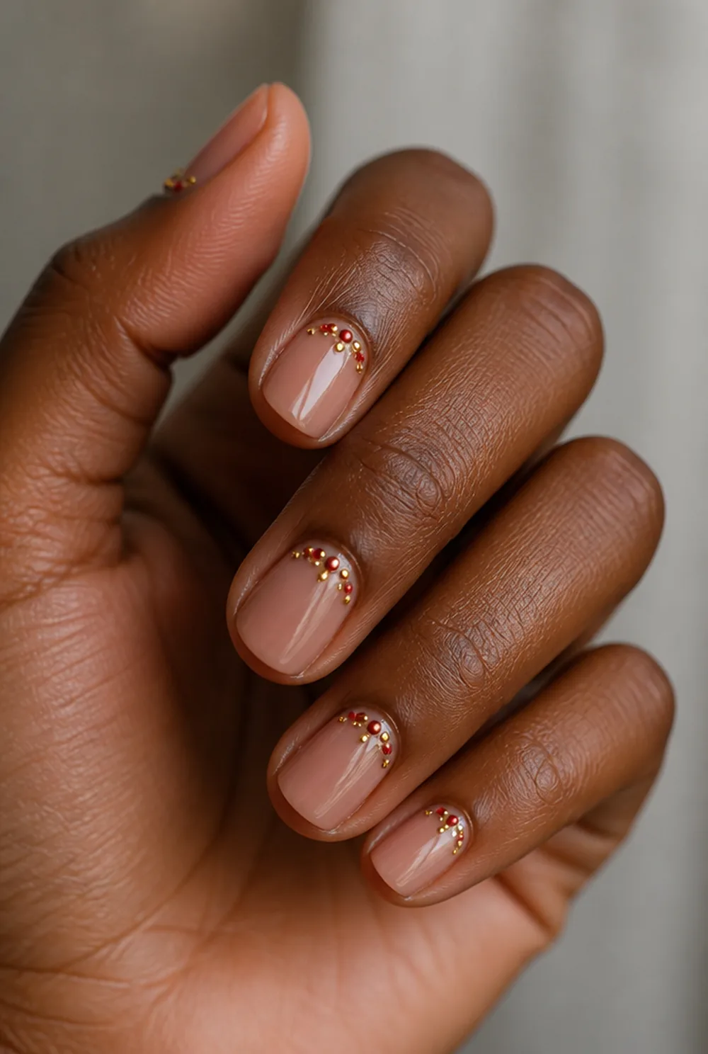 subtle ornament dots nail art on deep brown skin - PolishedAndPrettyNails.com subtle ornament dots nail art on deep brown skin