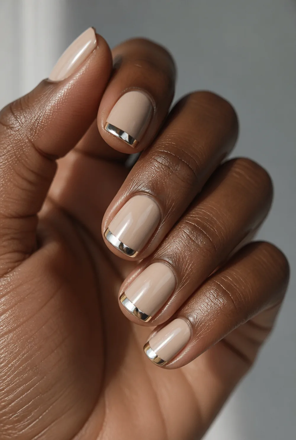 chrome french tips nail art on deep brown skin