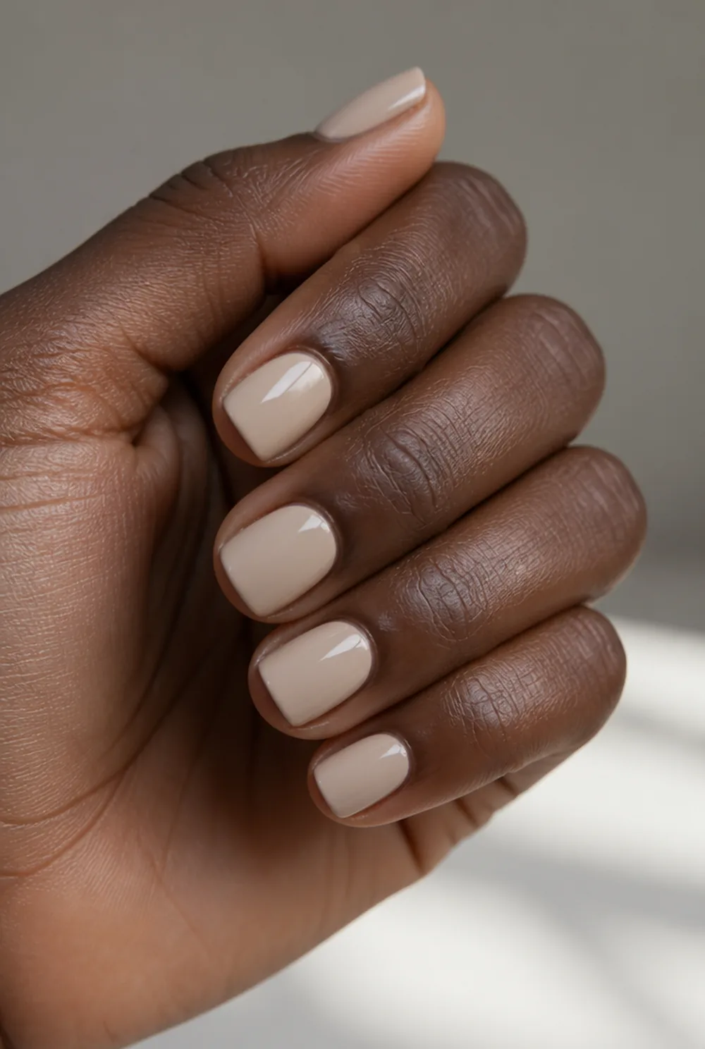 nude gloss square nail art on deep brown skin