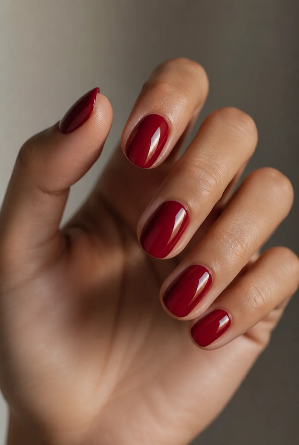 cherry red round nail art on olive skin, long length