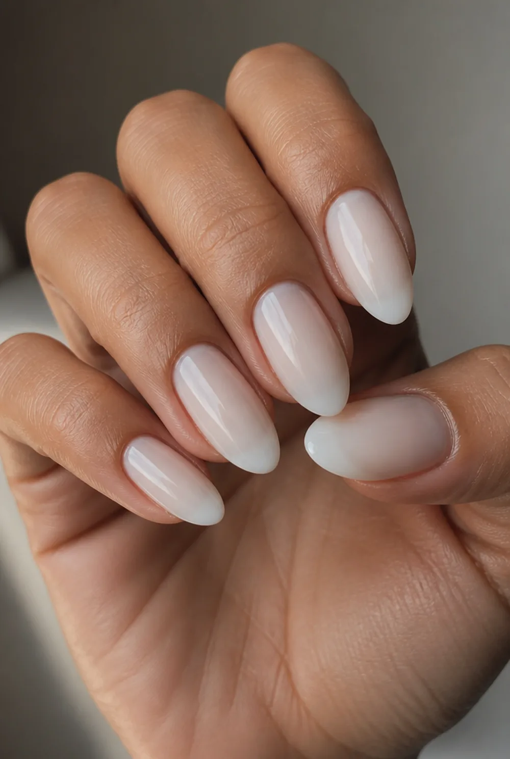 milky white shorties nail art on olive skin, long length