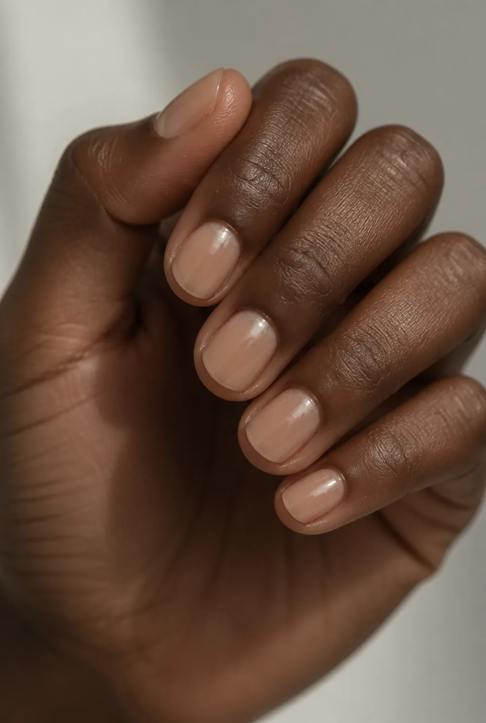nude jelly shorties nail art on deep brown skin