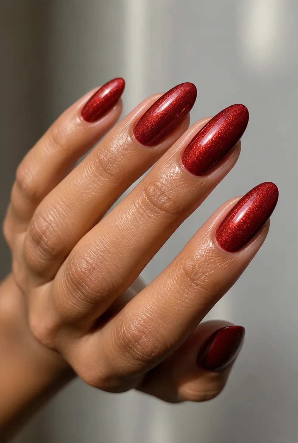 ruby shimmer nail art on olive skin, long length