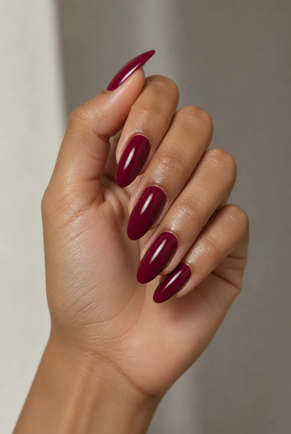 cranberry nail art on olive skin, long length