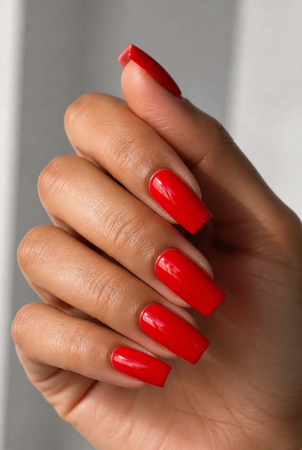 fire-engine square nail art on olive skin, long length