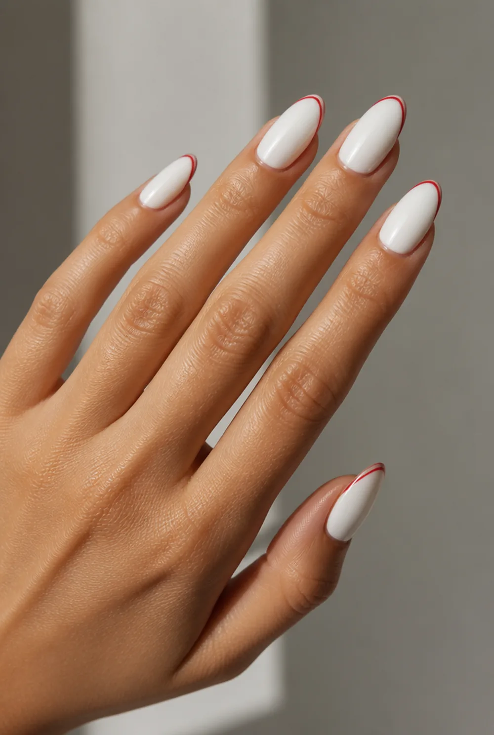 red french tips nail art on olive skin, long length