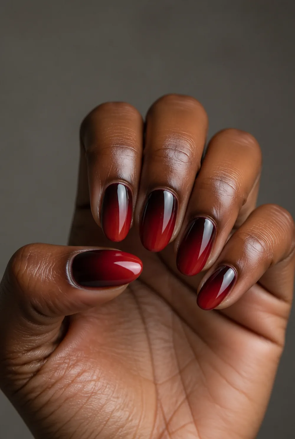 chocolate cherry ombre nail art on deep brown skin