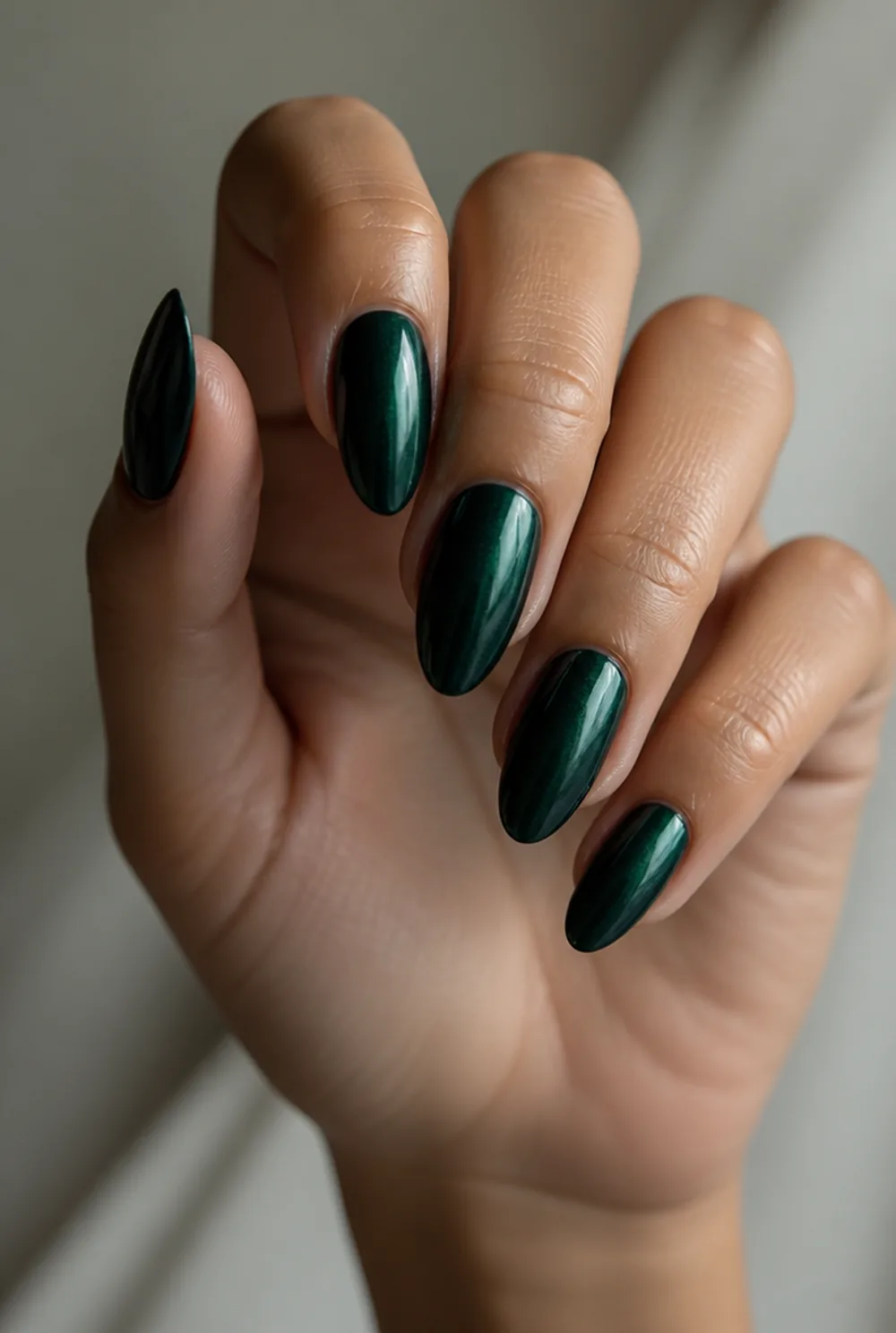 blackened emerald nail art on olive skin, long length