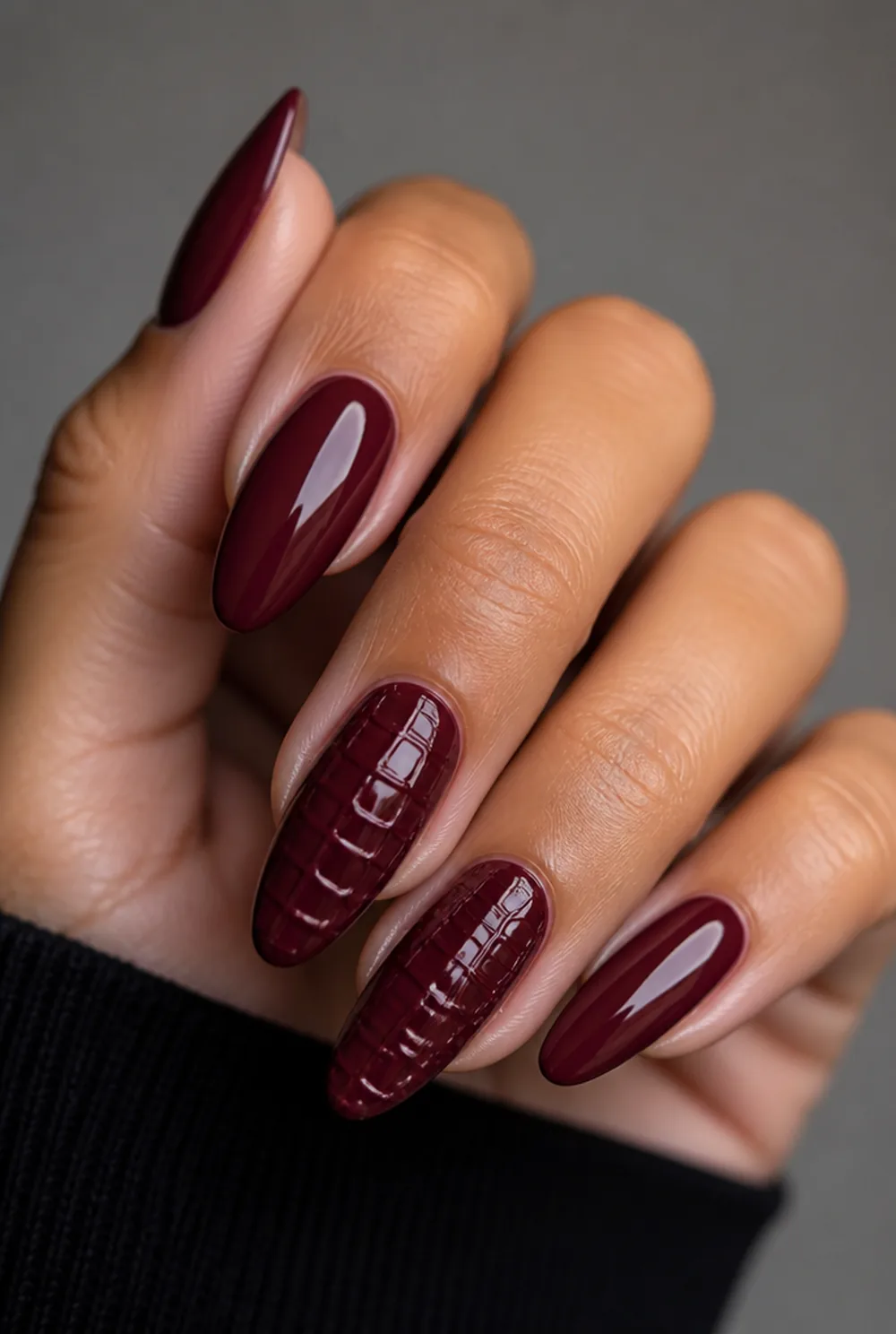 burgundy croc texture nail art on olive skin, long length