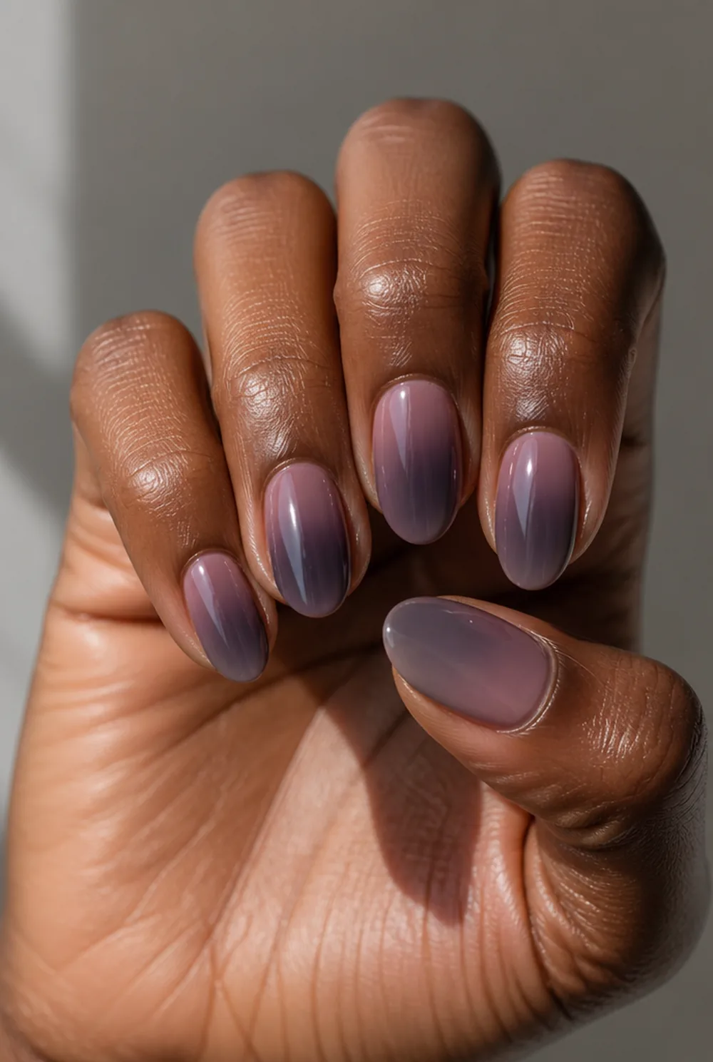 smoked mauve nail art on deep brown skin