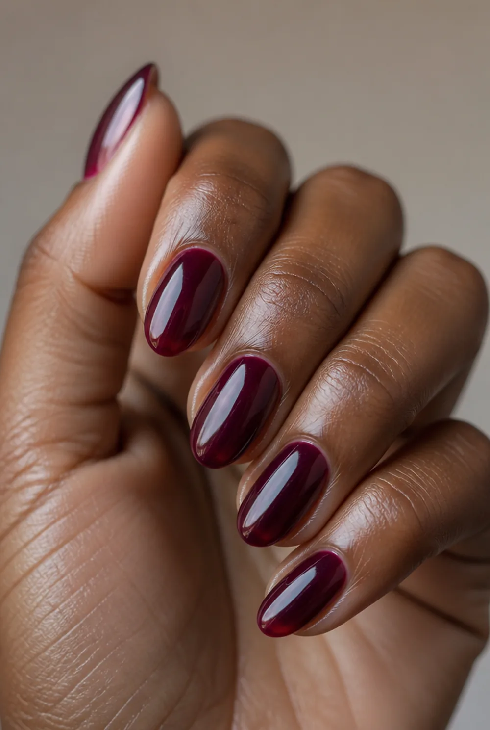 wine jelly nail art on deep brown skin