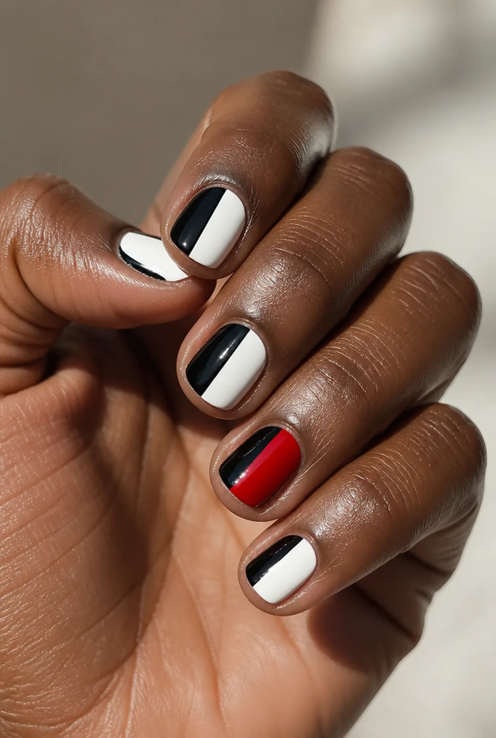 cruella split nail art on deep brown skin