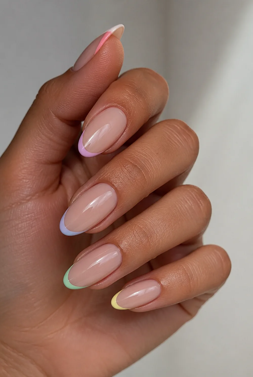 small world pastel french nail art on olive skin, long length