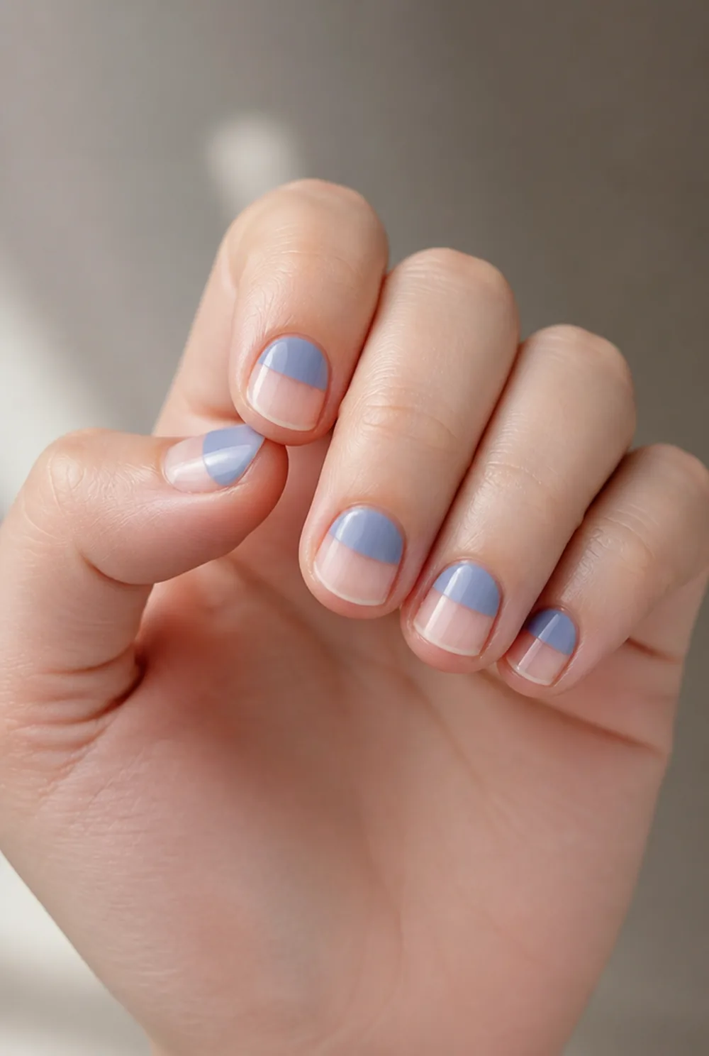 negative space arc nail art on fair skin, short length