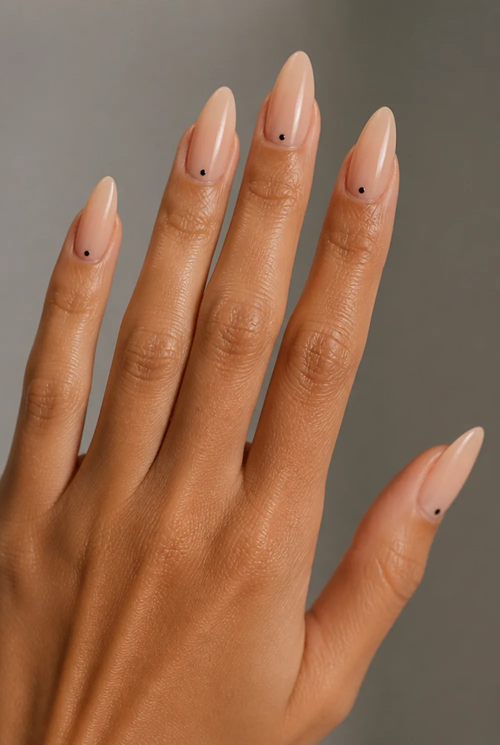 single dot accent nail art on olive skin, long length