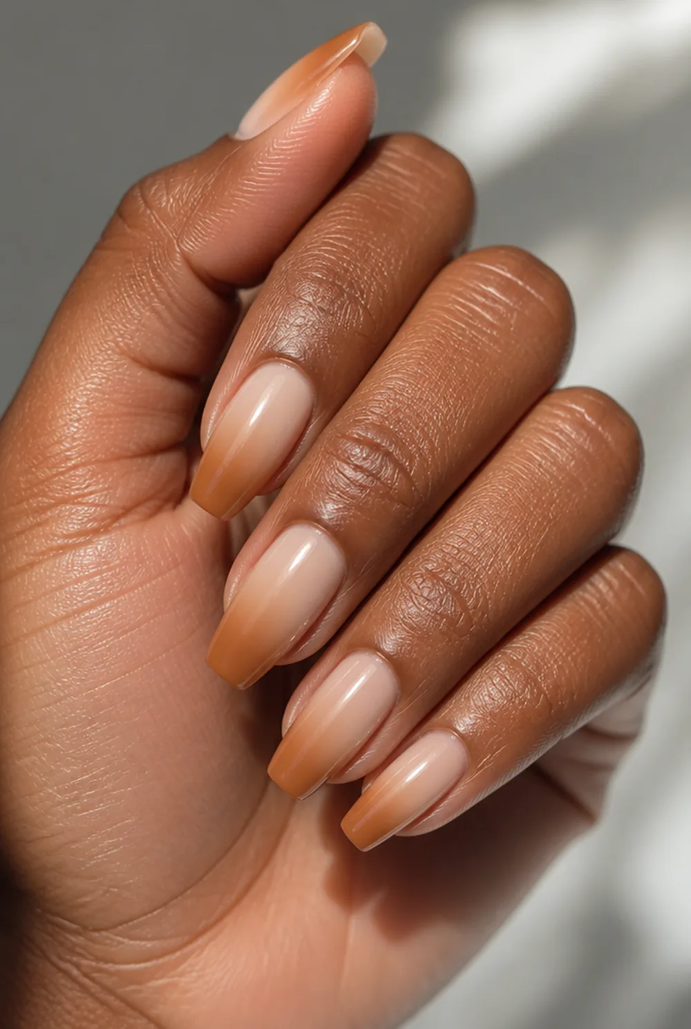 caramel-to-cream ombre nail art on deep brown skin