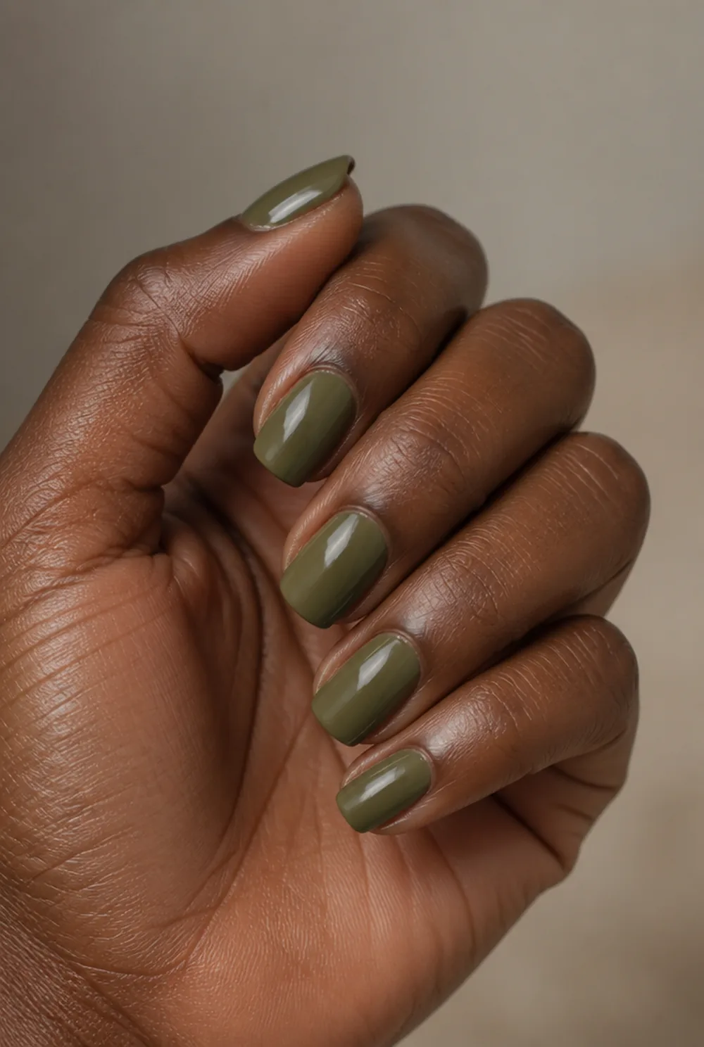 olive creme coffin nail art on deep brown skin
