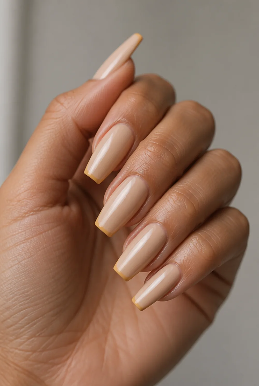 mustard micro french nail art on olive skin, long length