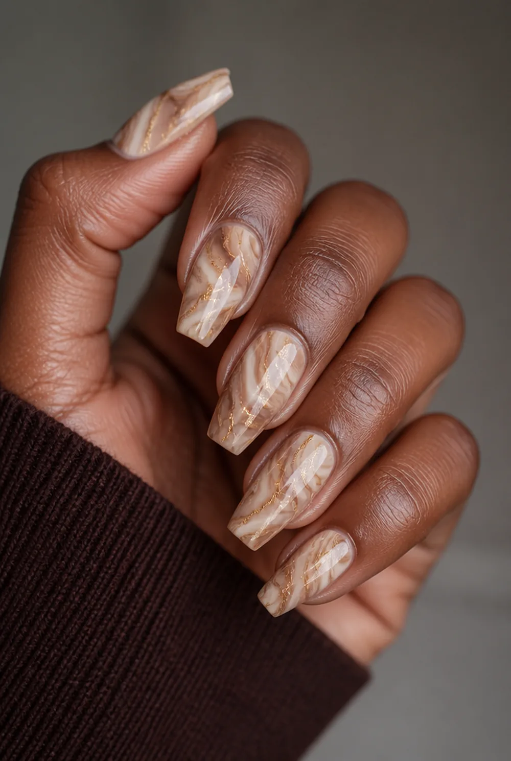 coffee marble nail art on deep brown skin
