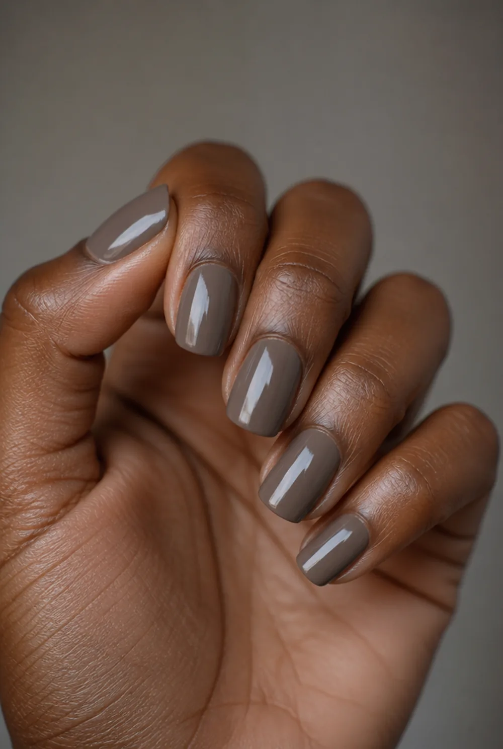 smoked taupe short coffin nail art on deep brown skin