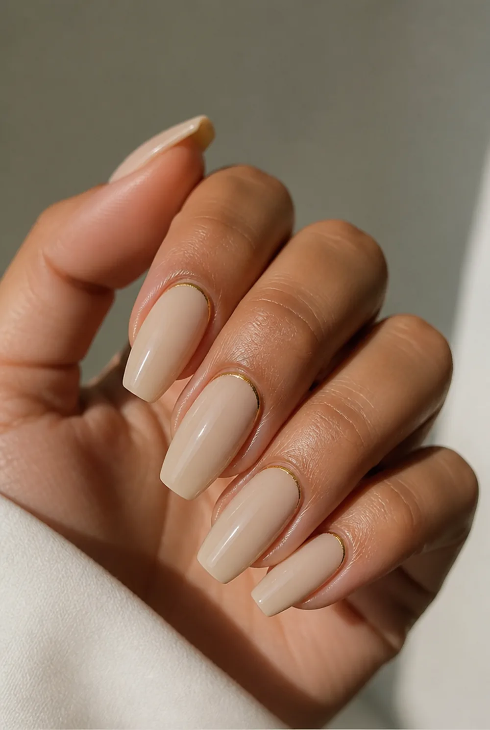 gold cuticle cuffs on nude nail art on olive skin, long length
