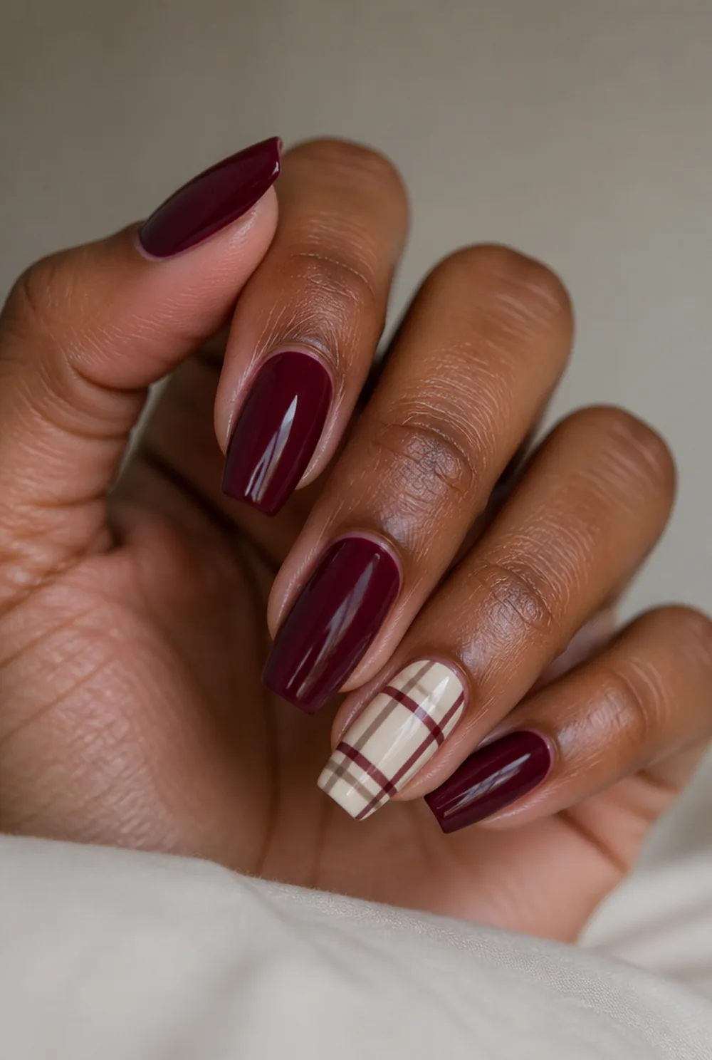 plaid accent coffin nail art on deep brown skin