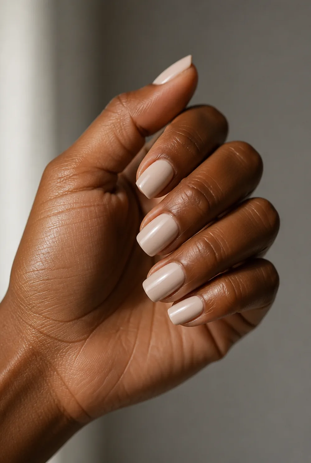 short latte coffin nail art on deep brown skin