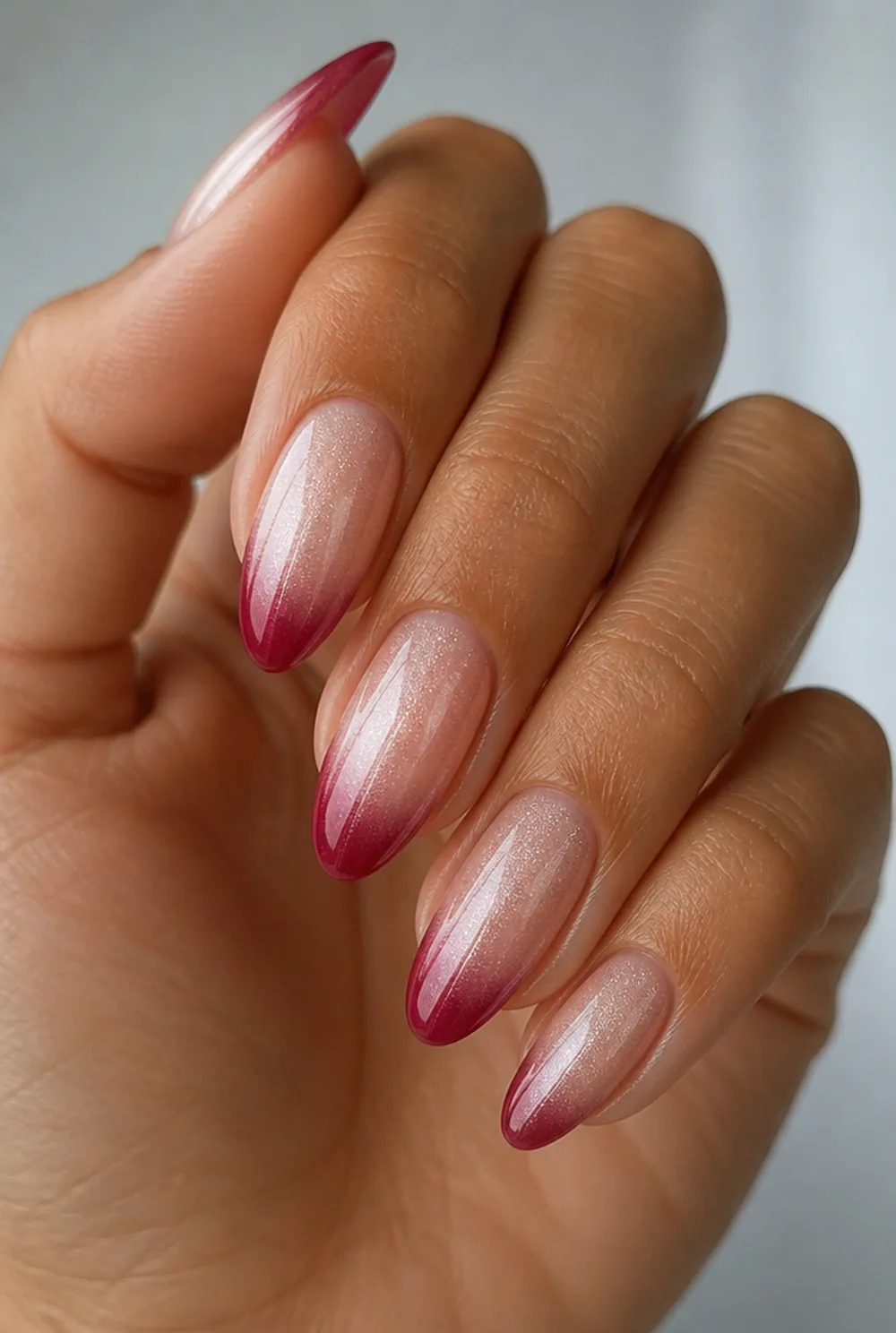 cranberry tips with a shimmer base nail art on olive skin, long length